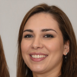 Joyful white young-adult female with long  brown hair and brown eyes