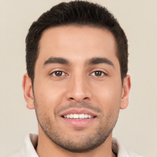 Joyful white young-adult male with short  brown hair and brown eyes