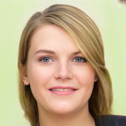 Joyful white young-adult female with long  brown hair and blue eyes