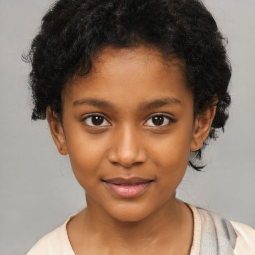 Joyful black child female with short  brown hair and brown eyes