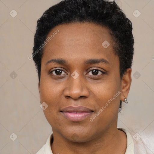 Joyful black young-adult female with short  black hair and brown eyes