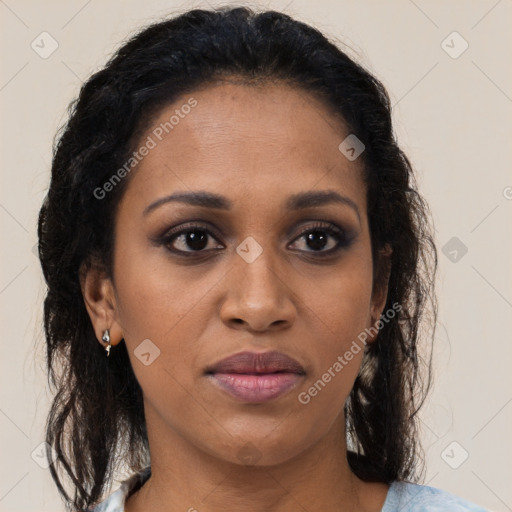 Joyful black adult female with medium  brown hair and brown eyes