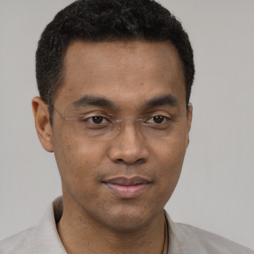 Neutral black young-adult male with short  black hair and brown eyes