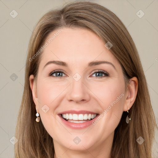 Joyful white young-adult female with long  brown hair and grey eyes