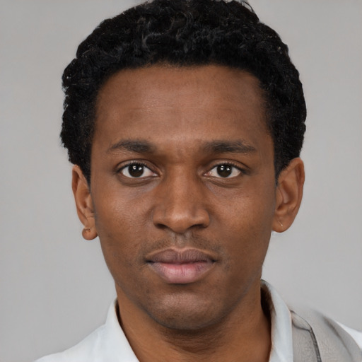 Neutral black young-adult male with short  black hair and brown eyes