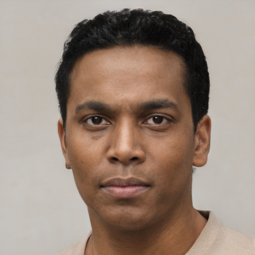 Neutral black young-adult male with short  black hair and brown eyes