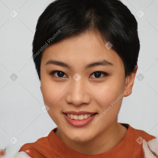 Joyful asian young-adult female with short  black hair and brown eyes