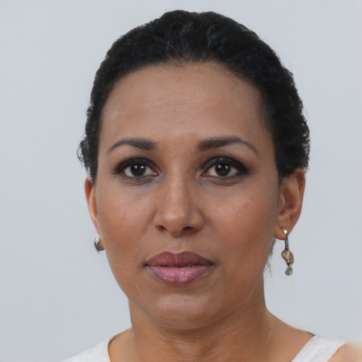 Neutral black adult female with short  black hair and brown eyes