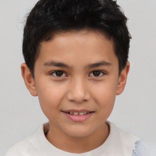 Joyful asian child male with short  brown hair and brown eyes