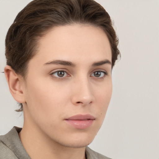 Neutral white young-adult female with short  brown hair and brown eyes