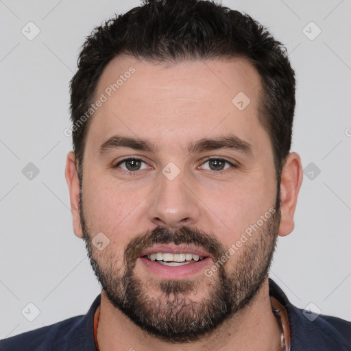 Joyful white young-adult male with short  black hair and brown eyes