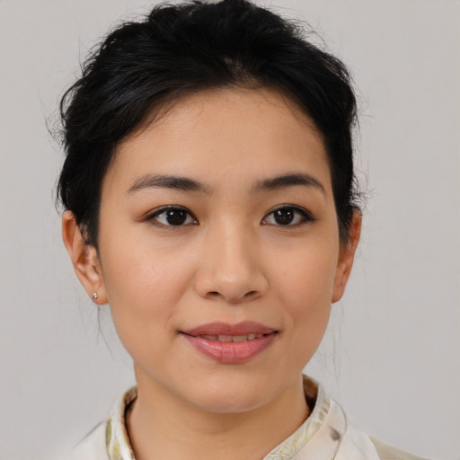 Joyful asian young-adult female with medium  brown hair and brown eyes