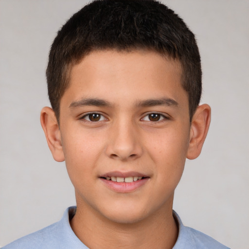 Joyful white child male with short  brown hair and brown eyes