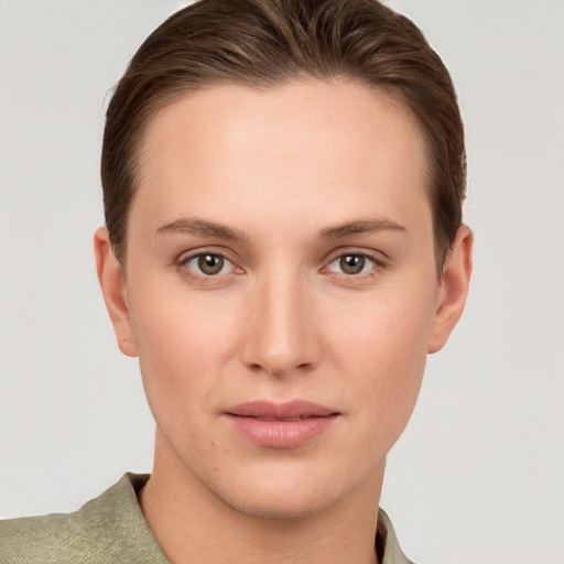 Joyful white young-adult female with short  brown hair and grey eyes