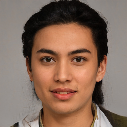 Joyful latino young-adult male with medium  black hair and brown eyes