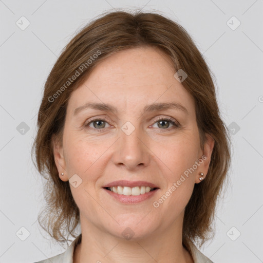 Joyful white adult female with medium  brown hair and grey eyes