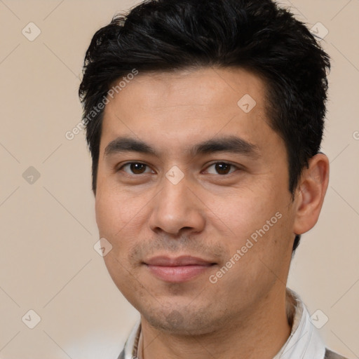 Joyful white young-adult male with short  black hair and brown eyes