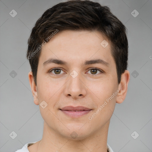 Joyful white young-adult male with short  brown hair and brown eyes