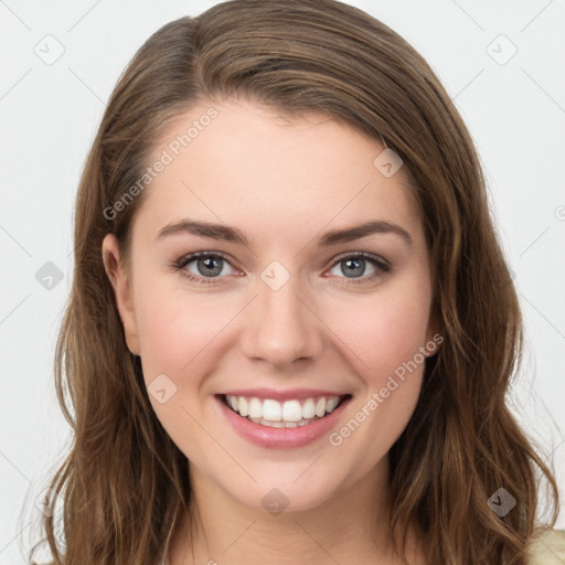 Joyful white young-adult female with long  brown hair and green eyes