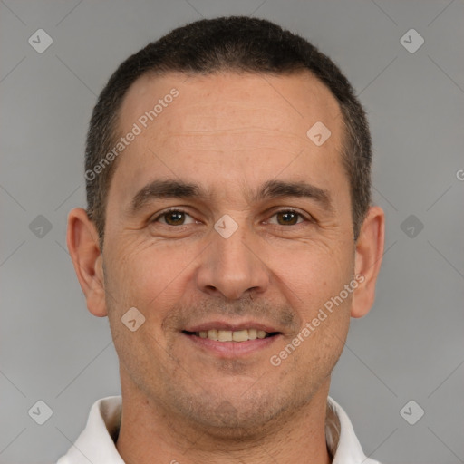 Joyful white adult male with short  brown hair and brown eyes