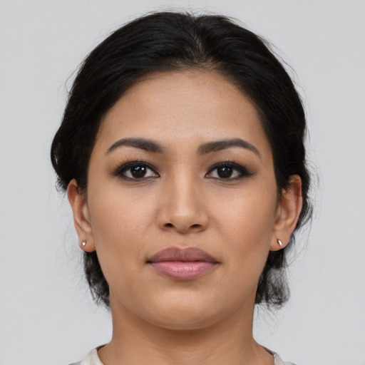 Joyful latino young-adult female with medium  black hair and brown eyes
