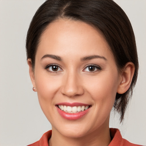 Joyful white young-adult female with medium  brown hair and brown eyes