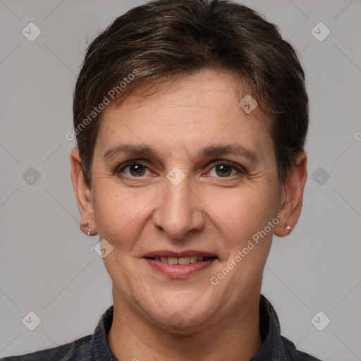 Joyful white adult female with short  brown hair and brown eyes