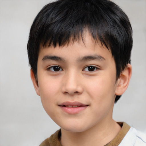 Joyful white child male with short  brown hair and brown eyes