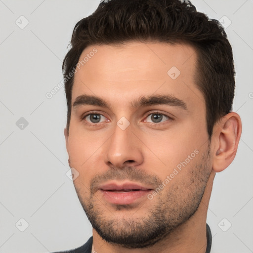 Joyful white young-adult male with short  brown hair and brown eyes