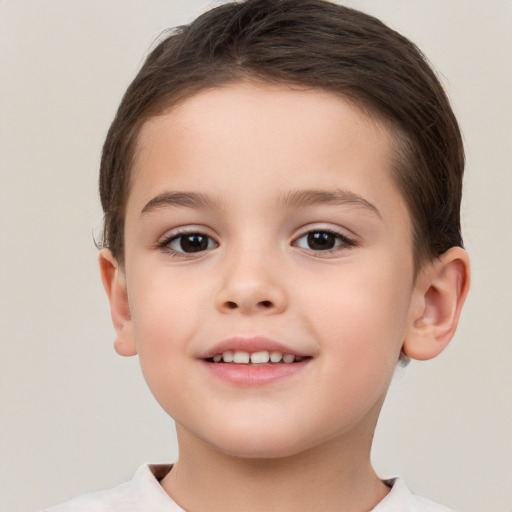 Joyful white child female with short  brown hair and brown eyes