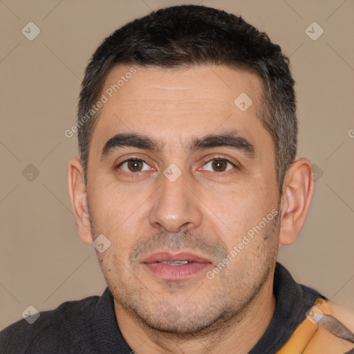 Joyful white adult male with short  brown hair and brown eyes