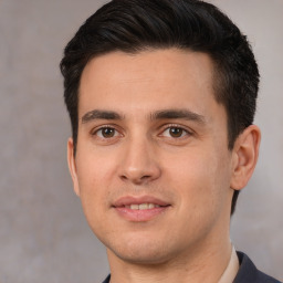 Joyful white young-adult male with short  black hair and brown eyes