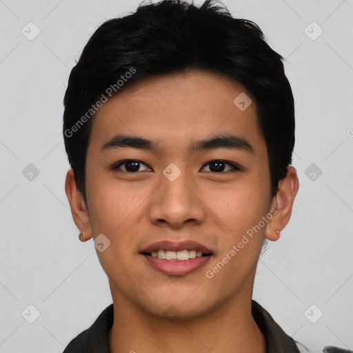 Joyful asian young-adult male with short  black hair and brown eyes