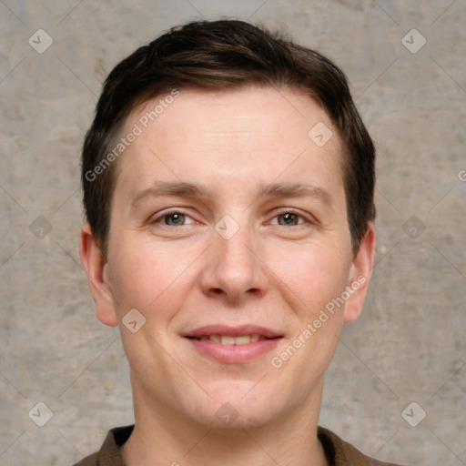 Joyful white adult male with short  brown hair and grey eyes