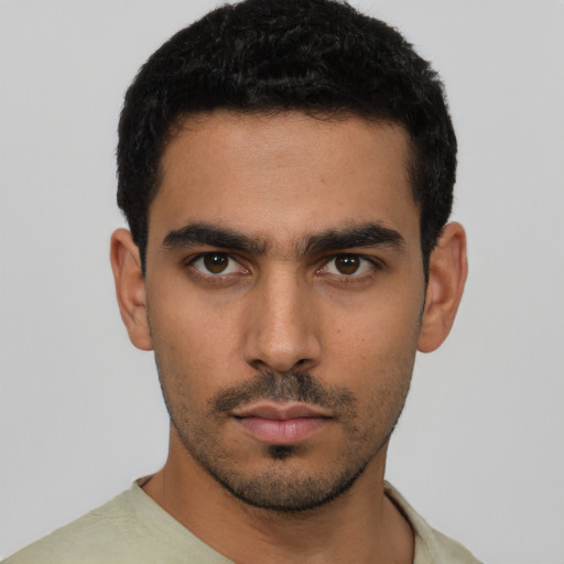 Neutral latino young-adult male with short  black hair and brown eyes