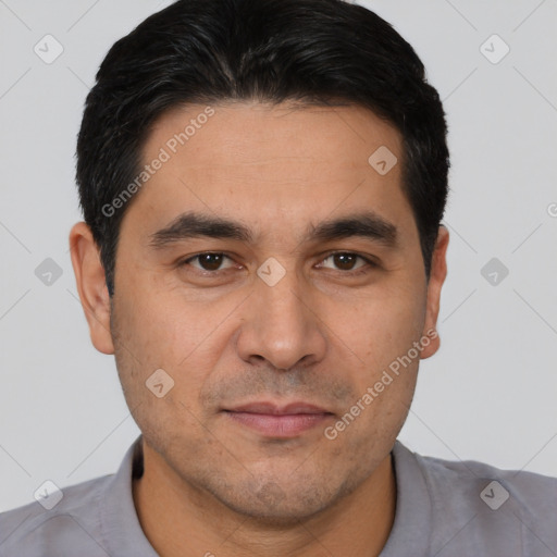 Joyful white young-adult male with short  black hair and brown eyes