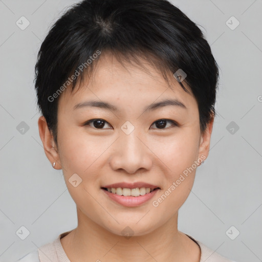 Joyful asian young-adult female with short  brown hair and brown eyes