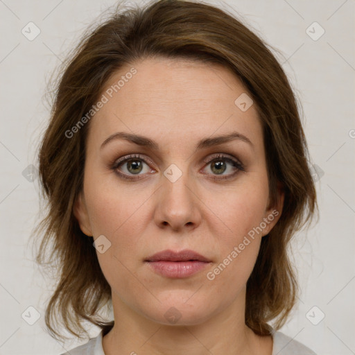 Joyful white young-adult female with medium  brown hair and green eyes