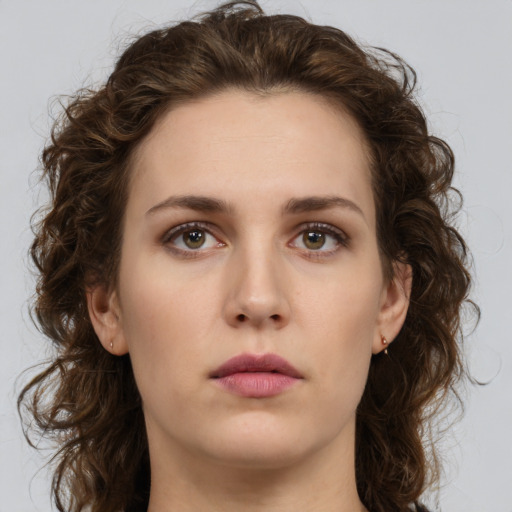 Neutral white young-adult female with medium  brown hair and green eyes