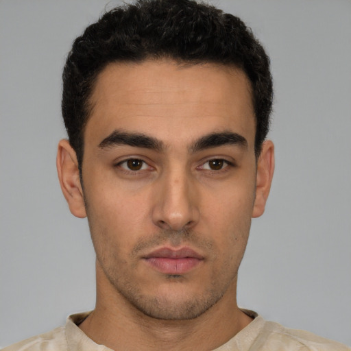 Neutral white young-adult male with short  black hair and brown eyes