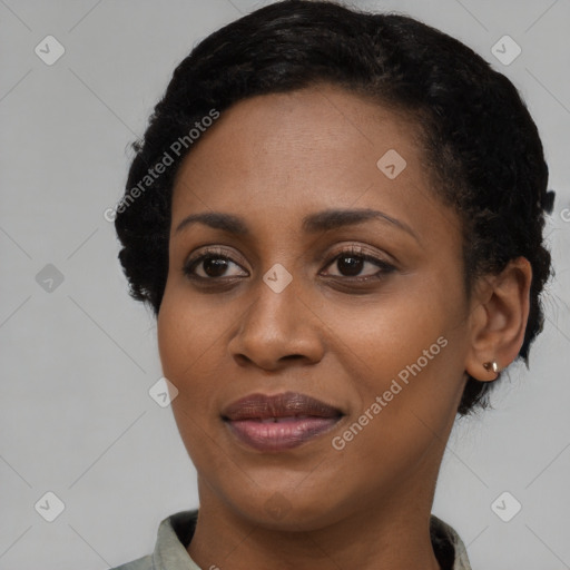 Joyful black young-adult female with short  black hair and brown eyes