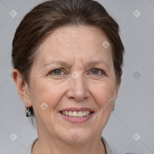 Joyful white middle-aged female with short  brown hair and grey eyes