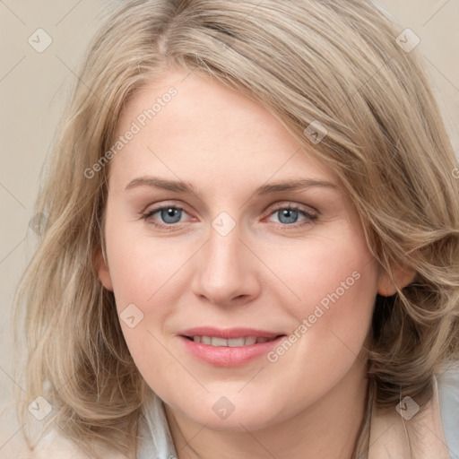 Joyful white young-adult female with medium  brown hair and blue eyes