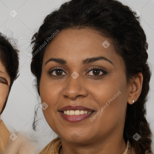 Joyful latino young-adult female with long  brown hair and brown eyes