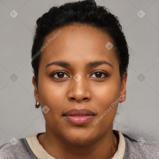 Joyful black young-adult female with short  black hair and brown eyes