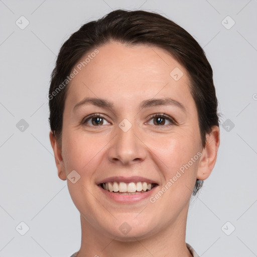 Joyful white young-adult female with short  brown hair and brown eyes