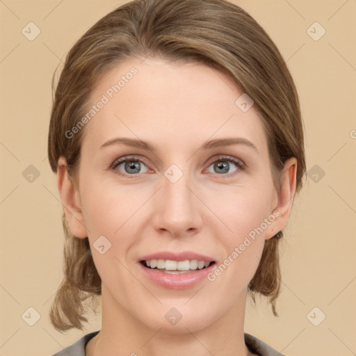 Joyful white young-adult female with medium  brown hair and grey eyes