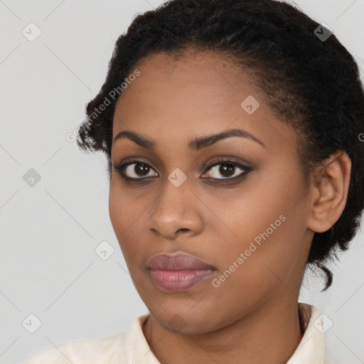 Joyful black young-adult female with medium  black hair and brown eyes