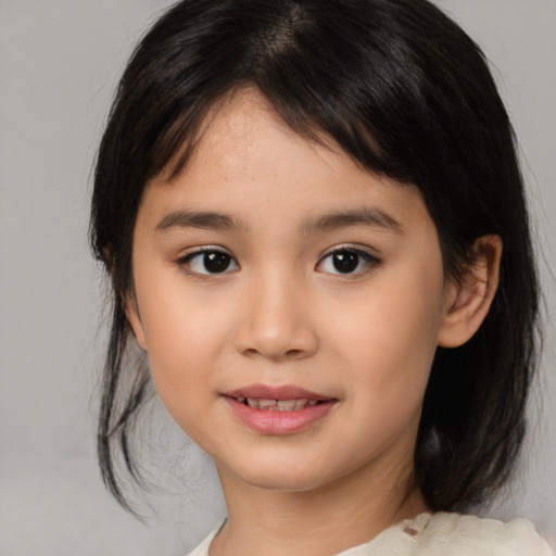 Joyful asian child female with medium  brown hair and brown eyes