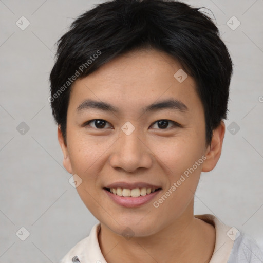 Joyful asian young-adult female with short  black hair and brown eyes